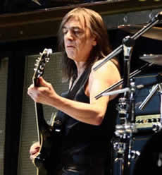 A photo of Malcolm Young playing guitar