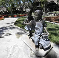 A photo of a boy girl statue at the Neverland Ranch
