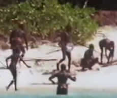 A photo of Sentinelese people on the beach