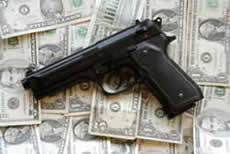A photo of a gun and money